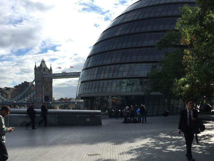 London City hall in front of London Bridge on a sunny day