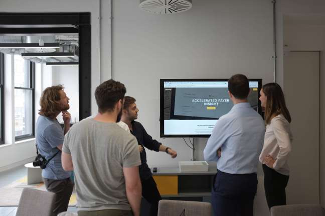 A group of people take part in a insight application workshop in our London office