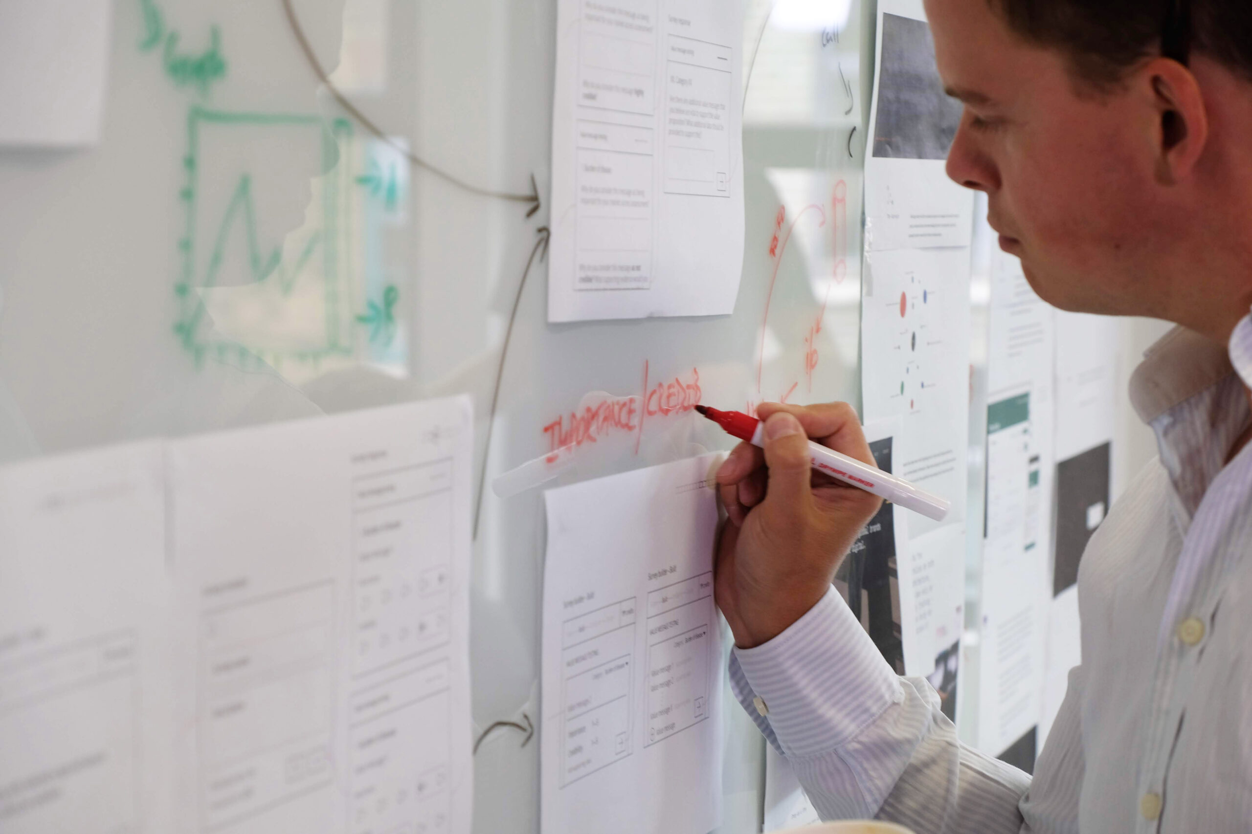 A person maps out a user journey during a digital project planning session