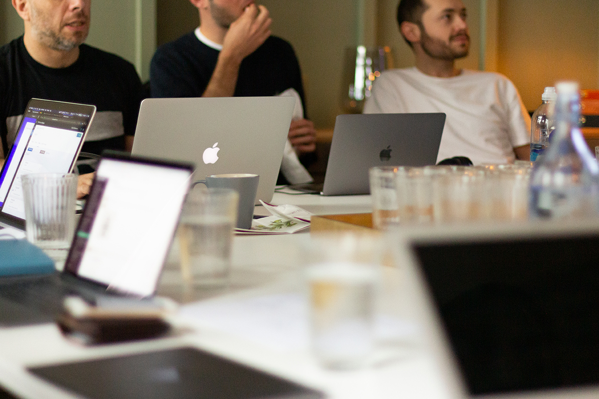 A team of developers work at their laptops at JAMS 2018